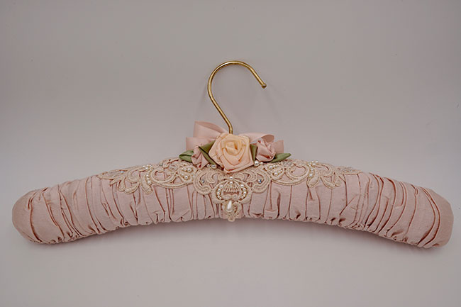 Freestanding lace on coat hanger